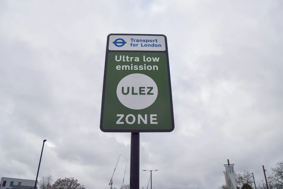 Close-up of green "Ultra low emission zone" ULEZ sign in London, UK.